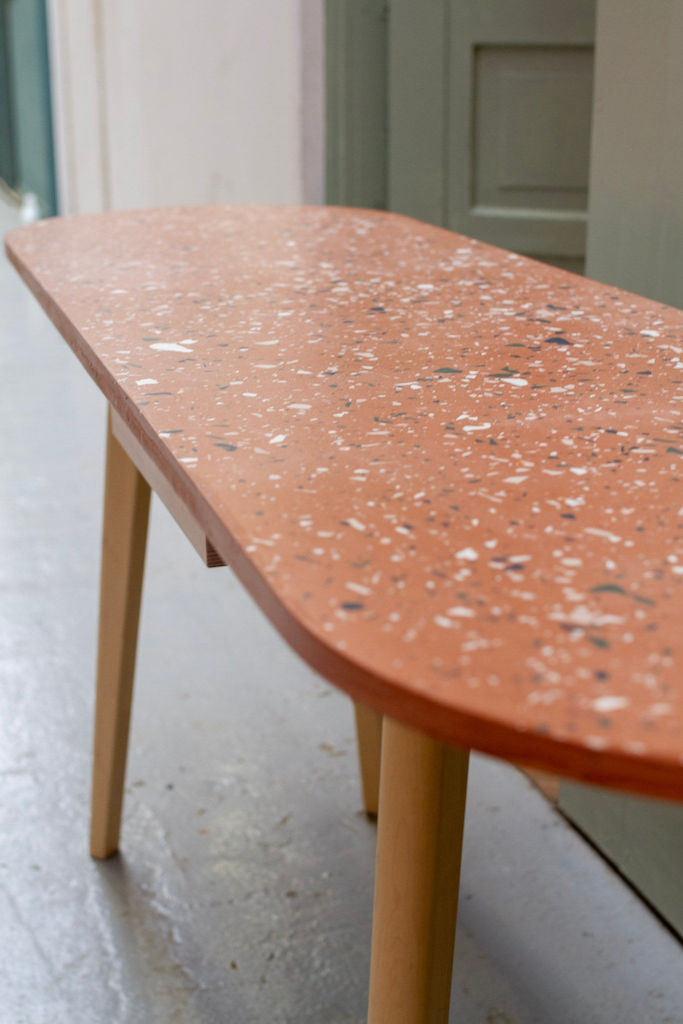 Jesmonite Terrazzo Table Top in terracotta with wooden legs