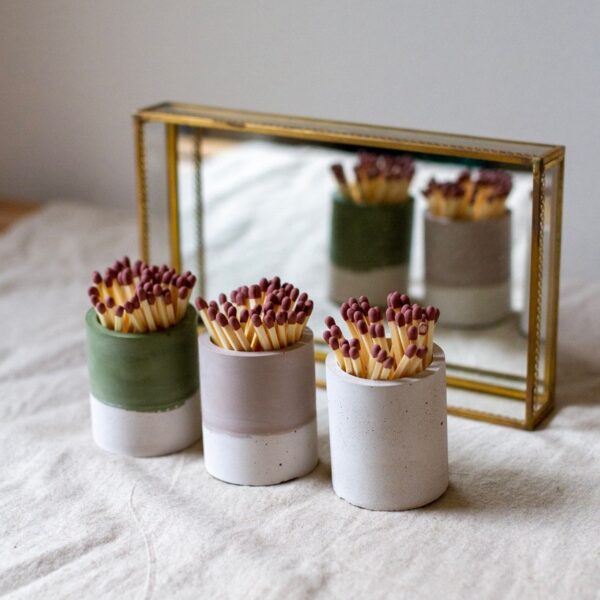 Three striker pots with a mirrored backdrop