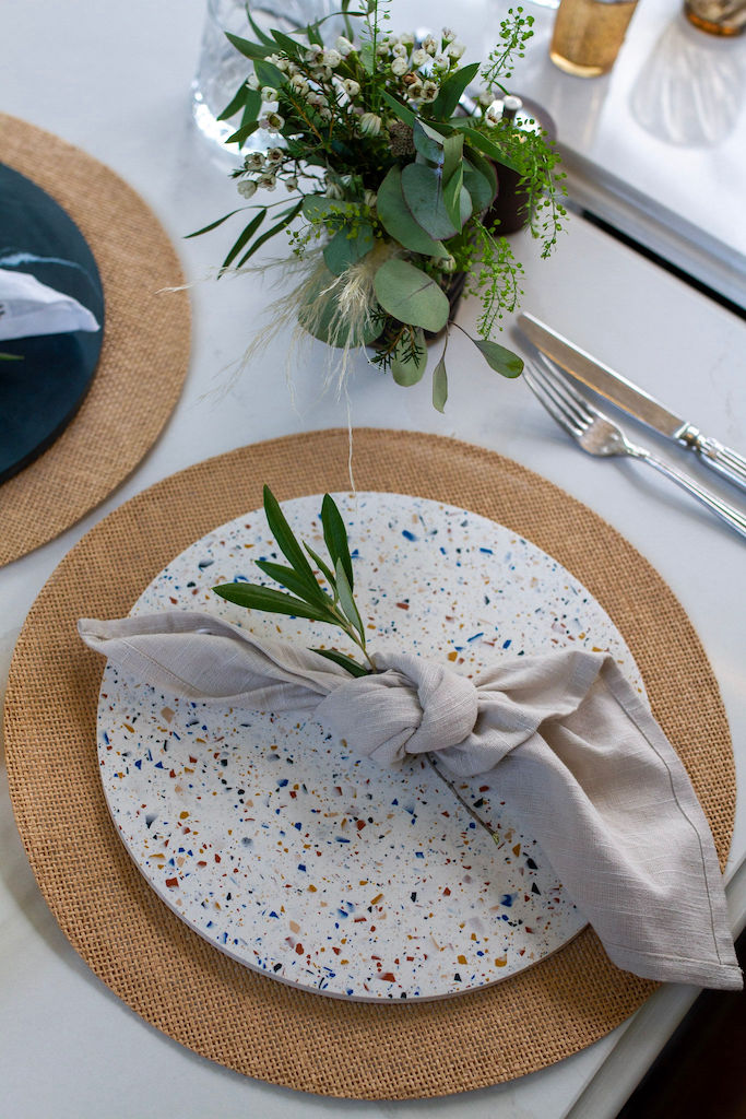 Amble colourway terrazzo placemats with linen napkin and flowers