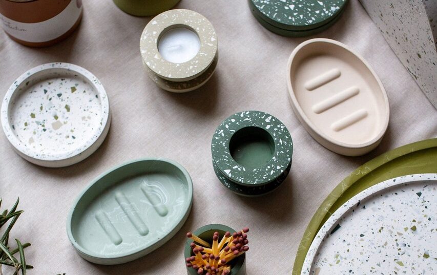 Selection of green & beige terrazzo homeware pieces.